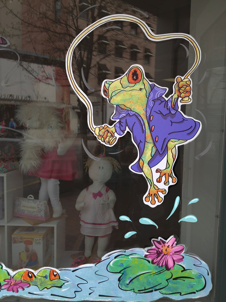 Freddy Frog decal show on boutique store window with hand painted lily pond.